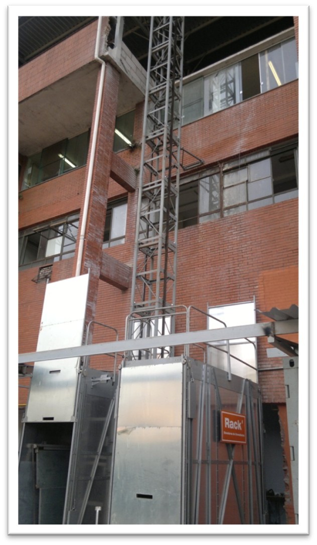 Elevator alongside an industrial facade